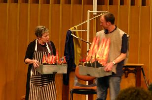 Cooks compare the height of their barbecue flames